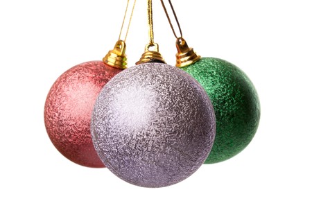 Three colored Christmas balls hanging on white background it's isolatedの写真素材