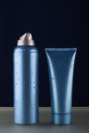 Foam for shaving, a cream after shaving on dark blue backgroundの写真素材