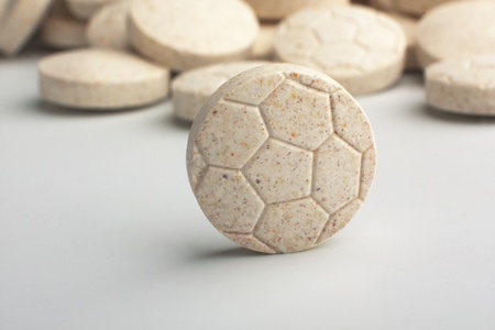 Heap of grassy tablets on a white backgroundの写真素材