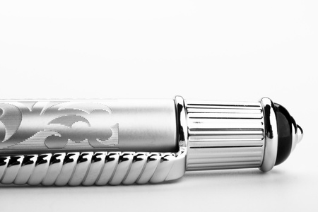 a part of metal business pen on the white paper. の写真素材
