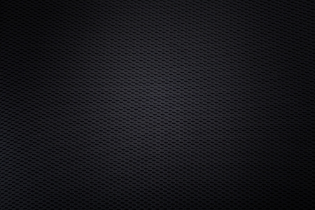 knitted black background with light spot in centerの写真素材