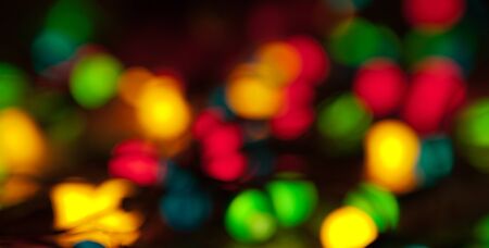 Christmas blur the background of glowing multicolored garlandsの写真素材