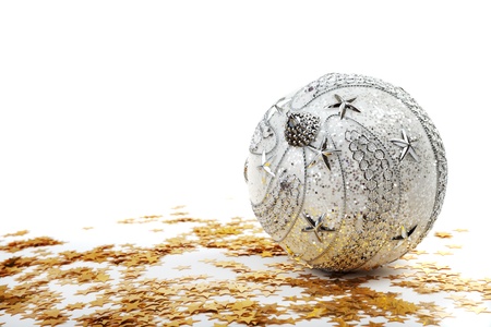 Silver Christmas bauble and golden stars on white backgroundの写真素材