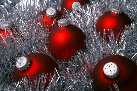 red christmas baubles on the silver tinselの写真素材