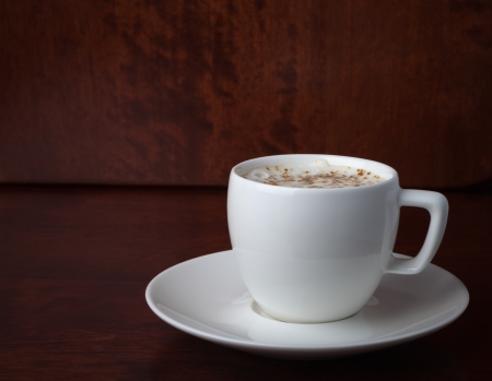 cup with coffee beans on a dark backgroundの写真素材
