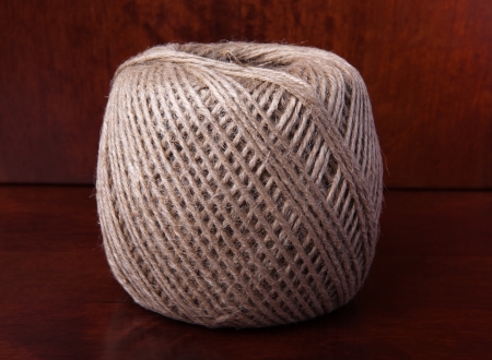 Natural Clew of Twine on the Wooden Backgroundの写真素材
