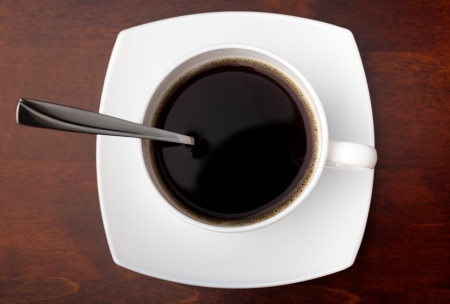 cup with coffee beans on a dark backgroundの写真素材