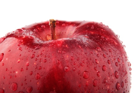 A Half of red apple on white background with dropsの写真素材