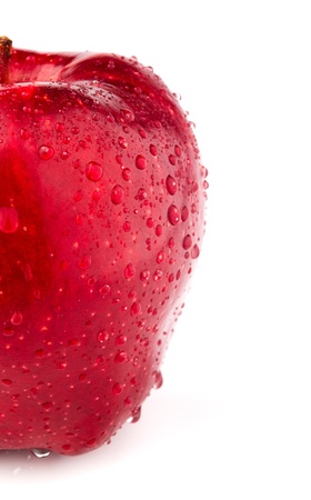 A Half of red apple on white background with dropsの写真素材
