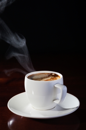 hot cup of fragrant coffee on a wooden tableの写真素材