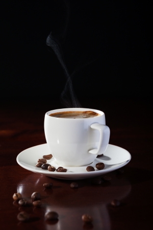 hot cup of fragrant coffee on a wooden tableの写真素材