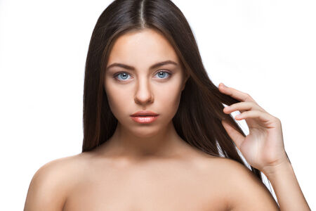attractive brunette woman portrait on white background isolatedの写真素材