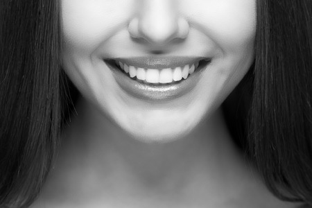 Beautiful woman smile. Teeth whitening. Dental care.