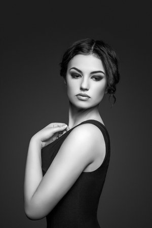 Beautiful woman with curly hair and evening make-up. Fashion art photo. Luxury woman.の写真素材