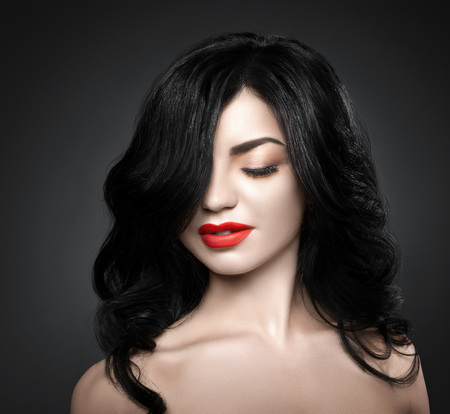 Beautiful brunette woman with shot hairstyle and sexy red lips.の写真素材