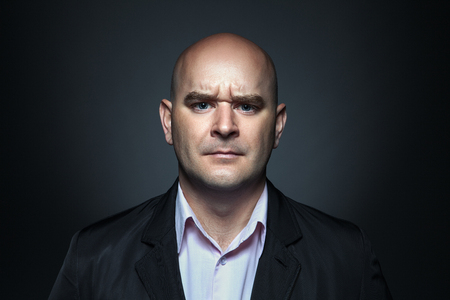 Portrait of a man with angry expressionの写真素材