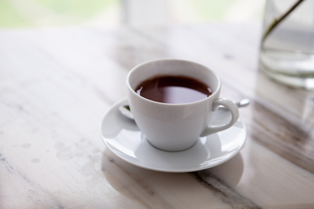cup of coffee on marble tableの写真素材