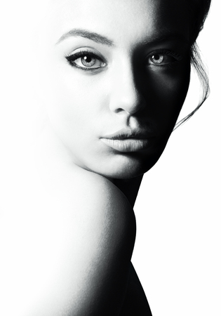 High contrast black and white portrait of a beautiful girl.の写真素材
