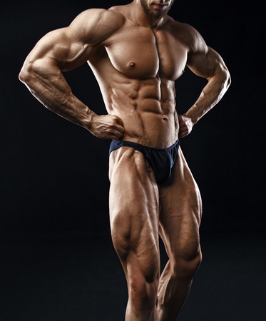 Bodybuilder man with perfect abs, shoulders,biceps, triceps and chest.の写真素材