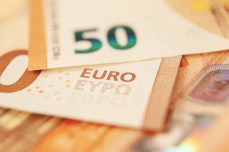 Macro shot of a banknote with a focus on the inscription Euro. Concept business, economy, investment.の写真素材