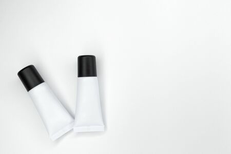 Tubes with cosmetics on a white background.の写真素材
