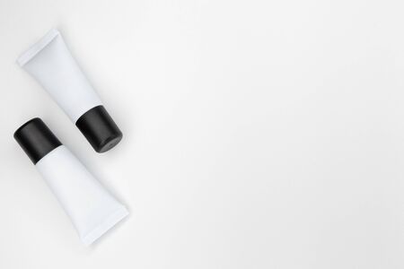 Tubes with cosmetics on a white background.の写真素材
