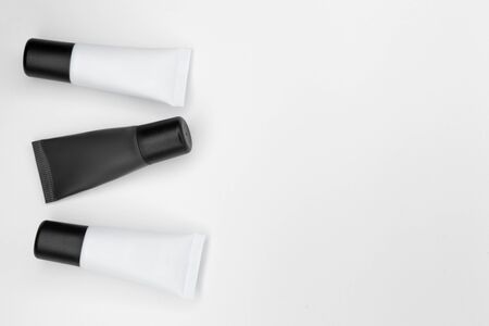 Tubes with cosmetics on a white background.の写真素材