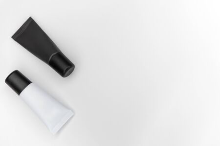 Tubes with cosmetics on a white background.の写真素材