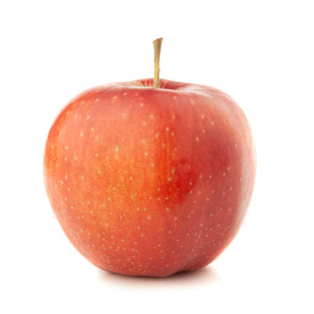 Red apple on a white background with a shadow.の写真素材