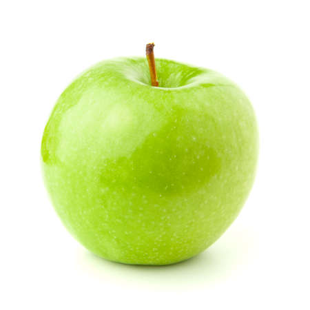 Green apple on a white background with a shadow.の写真素材