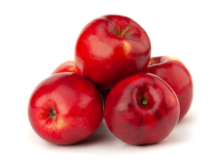 Several red apples lie on a white backgroundの写真素材