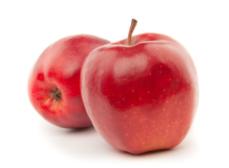Several red apples lie on a white backgroundの写真素材