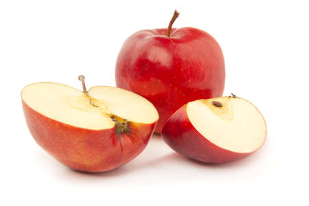 A whole and sliced red apple on a white background.の写真素材