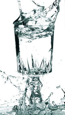 Glass of an alcoholic drink with ice isolated on white backgroundの写真素材