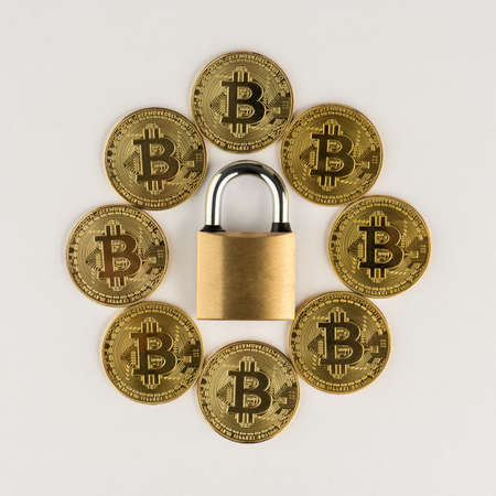 Bitcoin security concept. Bitcoin coins with padlock.