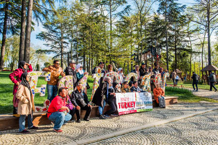 ISTANBUL, TURKEY - APRIL 12, 2019: Tourist group on Emirgan Park. Istanbul Turkey.のeditorial素材