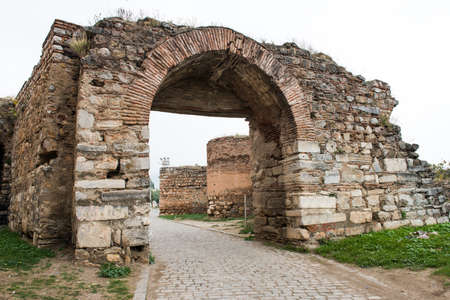 IZNIK, TURKEY - OCTOBER 21, 2018: Yenisehir Gate of ancient Iznik Castle. Historical stone walls and...