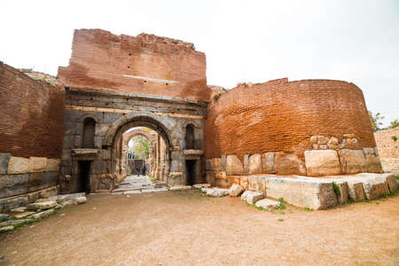 IZNIK, TURKEY - OCTOBER 21, 2018: Lefke Gate of ancient Iznik Castle. Historical stone walls and...