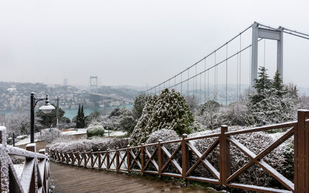 Snowy day in Istanbul, Turkey. View of Fatih Sultan Mehmet Bridge from Otagtepe. Beautiful winter landscape in Istanbul.の写真素材