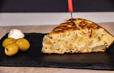 Delicious potato omelette with olives and mayonnaiseの写真素材