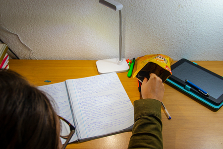 well lit desk writing in my diaryの写真素材