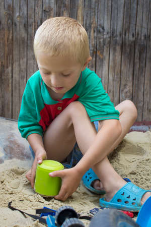bucket on the sand boyの写真素材