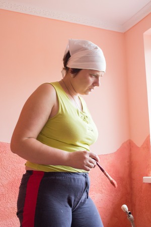 Working woman painter with brush in hand Paintの写真素材