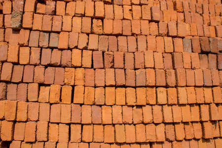 Wall or stack of red brick pavers at construction supply storeの写真素材
