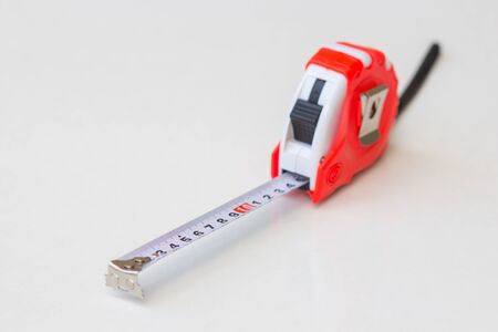 Tape measure tool red on a white background