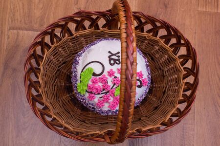 Easter cake cake in a basket top viewの写真素材