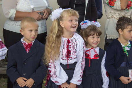 1 September 2014 Ukraine Mervychi,laughing schoolgirl girl on the ruler of the first bellのeditorial素材