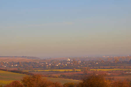 village in autumn at sunset,late autumn evening landscape comes over the villageの写真素材