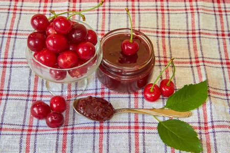 cherry jam,cherry jam with ripe cherries on the tableの写真素材