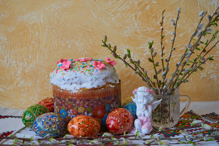 beautiful festive Easter background, on the table Ukrainian Easter cake with blooming willow